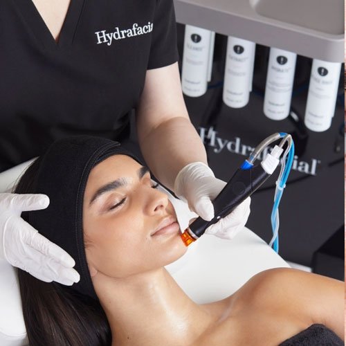 A clinician performing a HydraFacial treatment